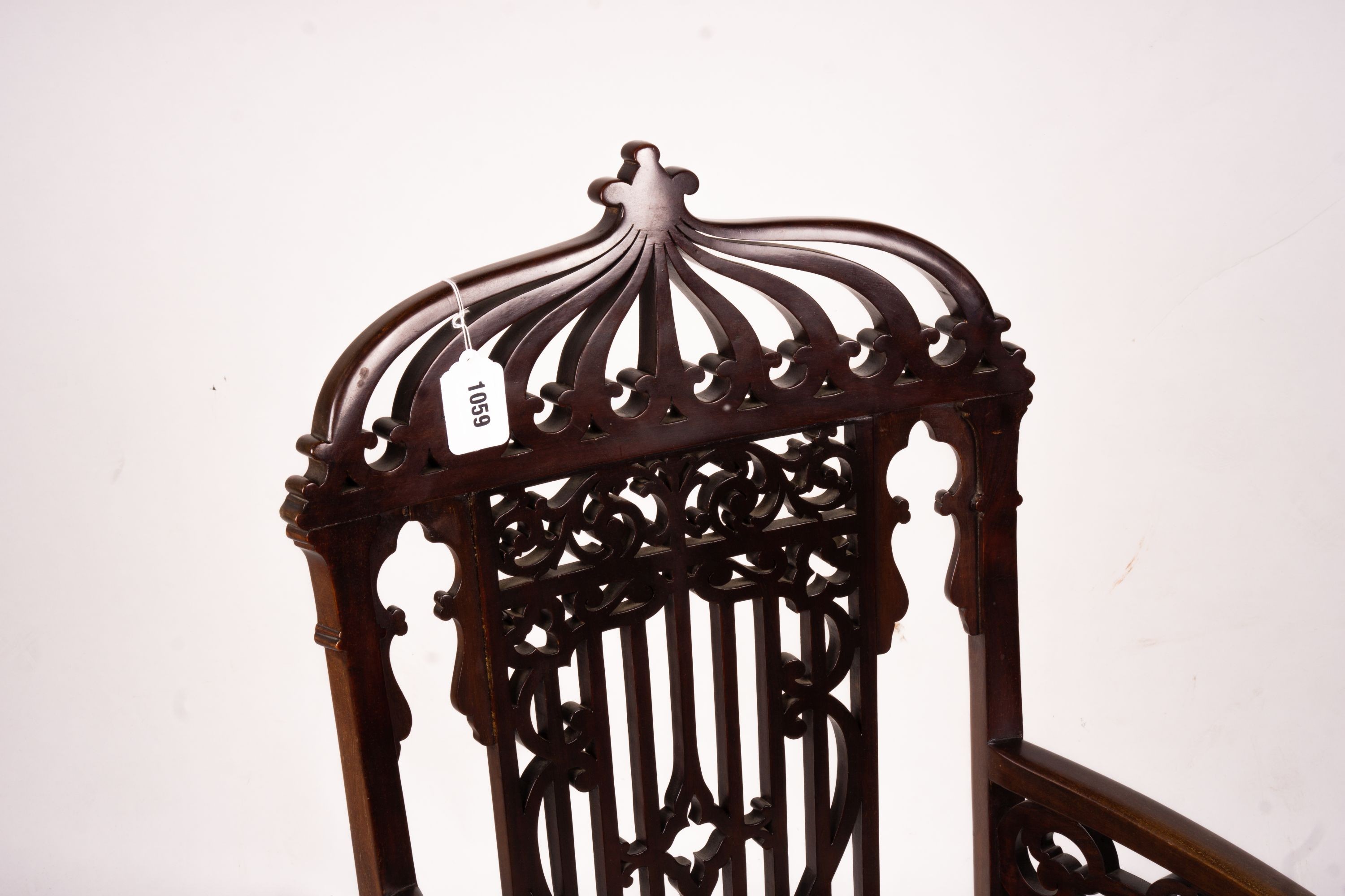 A late Victorian carved mahogany elbow chair